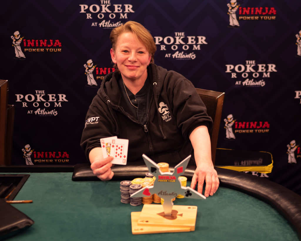 Christine Prichard poses with her trophy after winning an iNinja Poker tour trophy at Atlantis casino. 